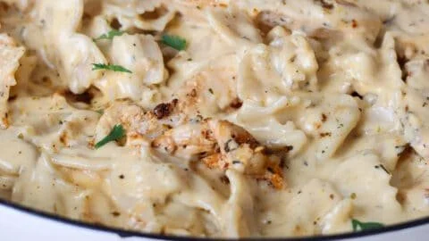 Delicious Chicken Garlic Parmesan Pasta served in a bowl with garnishes.